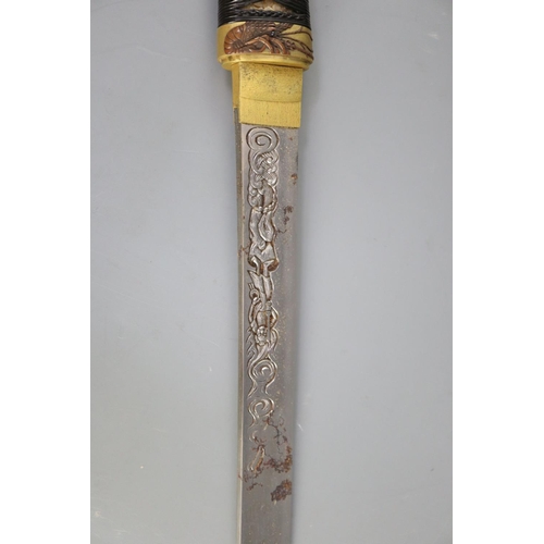 19 - A fine Japanese 'sea creatures' tanto, Meiji period, the saya lacquered to simulate wood grain and g... 