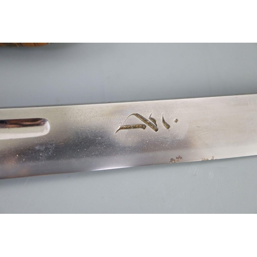 19 - A fine Japanese 'sea creatures' tanto, Meiji period, the saya lacquered to simulate wood grain and g... 