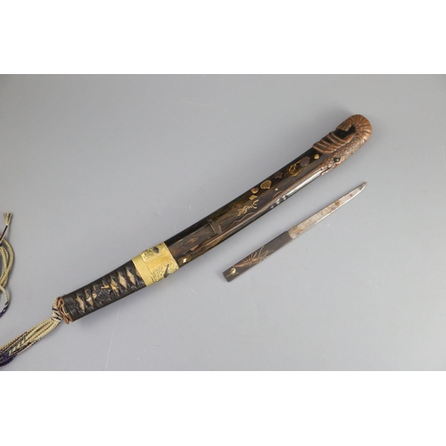 19 - A fine Japanese 'sea creatures' tanto, Meiji period, the saya lacquered to simulate wood grain and g... 