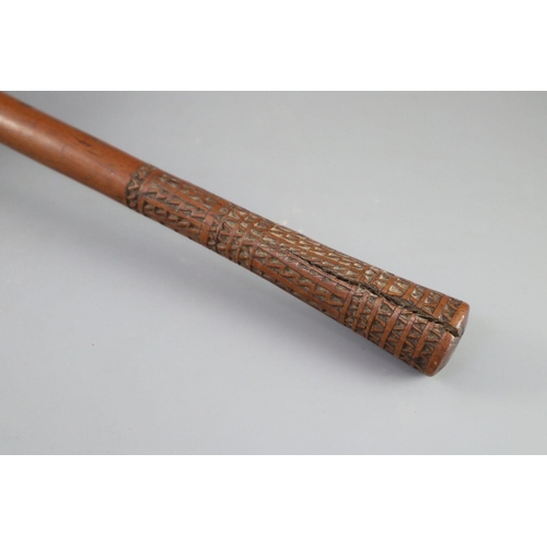 21 - A 19th century Fijian Ula throwing club, with geometric carved handle, length 15.75in. diameter 4.25... 