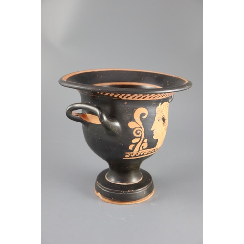 24 - An Apulian red figure bell krater, Southern Italy c. 4th century BC, painted with a woman's head, th... 