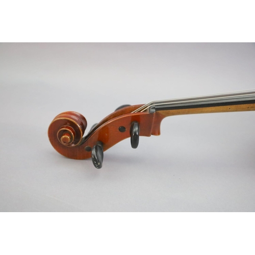 31 - A late 19th/early 20th century German cello, labelled 'Schutz HD junior Marke', with little curl to ... 