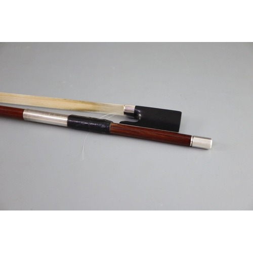32 - A late 19th/early 20th century silver mounted bow, unmarked, 74cm long