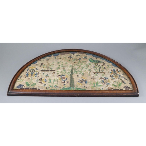37 - A late 17th century silk and bead work arched panel, with central tree, birds, butterflies, exotic l... 