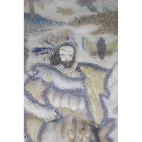 38 - A 17th century English needle and stumpwork panel, with central king like figure standing in a lands... 