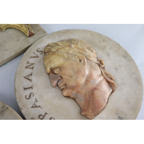 44 - After the antique. A pair of early 19th century Italian marble roundels, carved with the heads of Pi... 