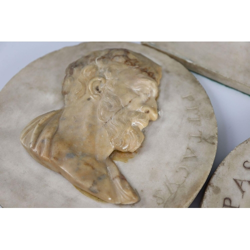 44 - After the antique. A pair of early 19th century Italian marble roundels, carved with the heads of Pi... 