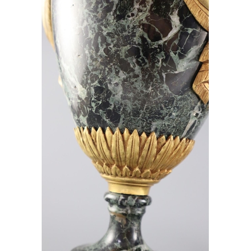 51 - A pair of early 20th century ormolu green marble table lamps, with ovular form with mask lug handles... 