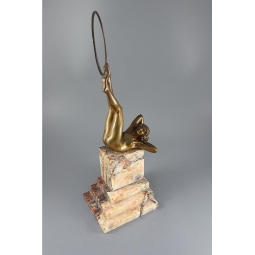 55 - Claire Jeanne Roberte Colinet (1880–1950) - an Art Deco patinated bronze figure of a naked hoop danc... 