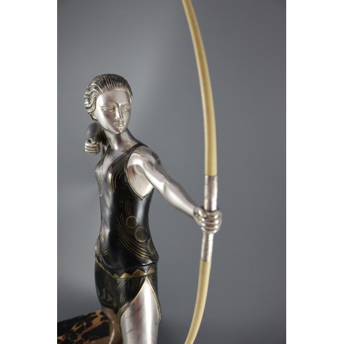 59 - Lucien Gibert (1904-1988) - an Art Deco silvered spelter figure of a female archer, standing with iv... 