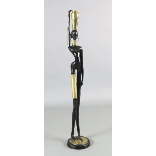 60 - Karl Hagenauer. A brass and ebonised bronze figure of an African water carrier, with vase on her hea... 
