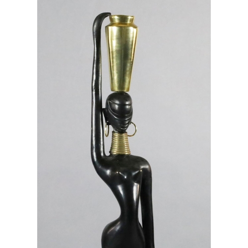 60 - Karl Hagenauer. A brass and ebonised bronze figure of an African water carrier, with vase on her hea... 