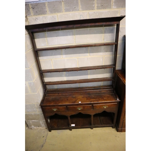 27 - An 18th century George III oak dresser, width 135cm, depth 40cm, height 185cm