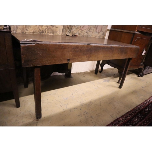5 - An 18th century provincial oak drop flap dining table, width 155cm, depth 66cm, height 71cm... 