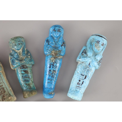 10 - Five Egyptian turquoise glazed faience shabti and three fragments, New Kingdom to late period, some ... 