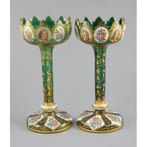 102 - A pair of Bohemian enamelled white overlaid green glass vases, late 19th century, with crenellated t... 