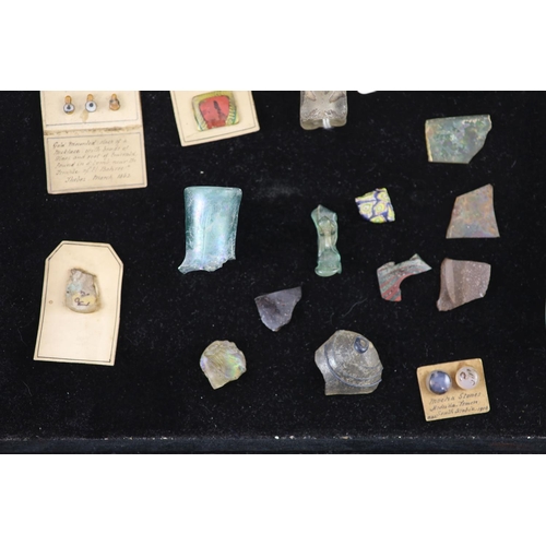 11 - A group of three Roman glass vessels and Egyptian/Roman glass fragments, many with old collection la... 