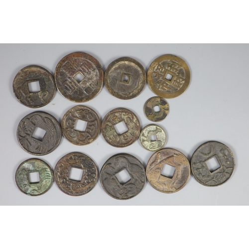 130 - China, a group of 14 bronze coin charms or amulets, Qing dynasty, variously inscribed - two Tai Ping... 