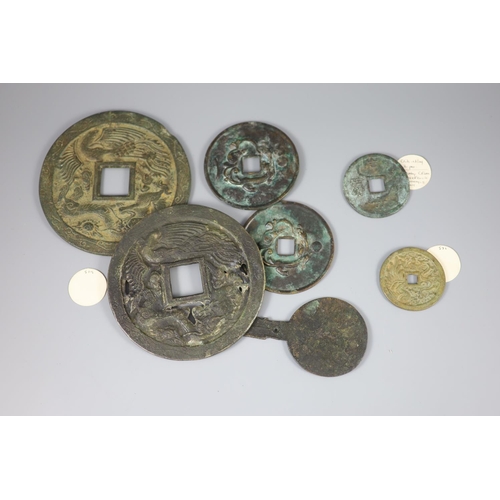 131 - A group of 7 Chinese bronze coin charms or amulets, Qing dynasty- Republic period, to include a Huo ... 