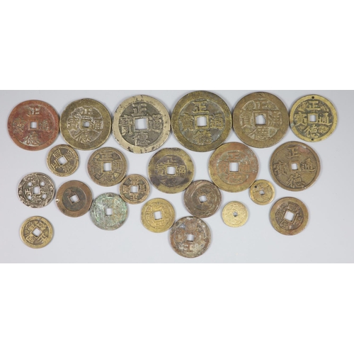 132 - China, a group of 22 bronze or copper coin charms, Qing dynasty, each inscribed 'Zheng De Tong bao',... 