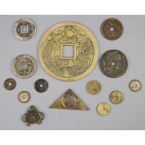 133 - China, a group of 14 bronze and brass coin charms or amulets, Qing to Republic period, F to VF to in... 