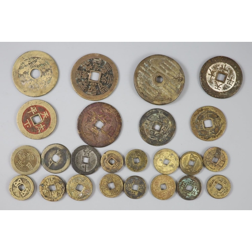 147 - China, 24 bronze charms or amulets, Qing dynasty, two obv. magical spell characters, rev. Eight Trig... 