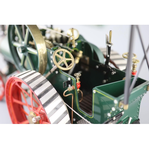 15 - A Maxwell Hemmens Precision Steam Models agricultural traction engine, with green and red paintwork,... 