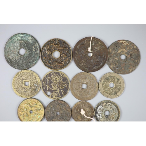 159 - China, 17 bronze or copper charms or amulets, Qing dynasty or earlier, fifteen with pictorial obvers... 