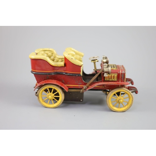 16 - A Bing clockwork tinplate car, c.1906, with cream painted seats, red bodywork and yellow wheels, len... 