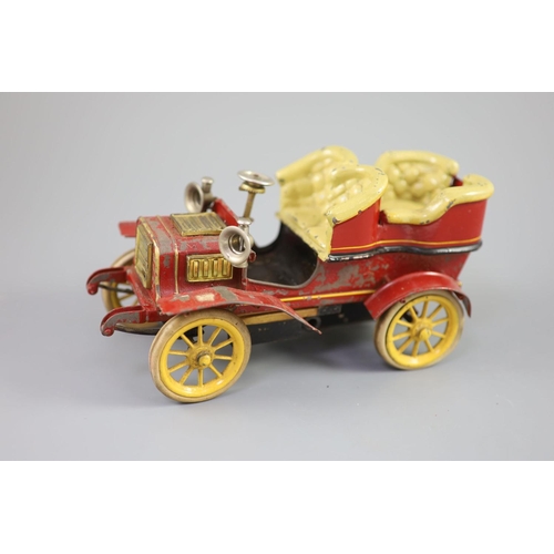 16 - A Bing clockwork tinplate car, c.1906, with cream painted seats, red bodywork and yellow wheels, len... 