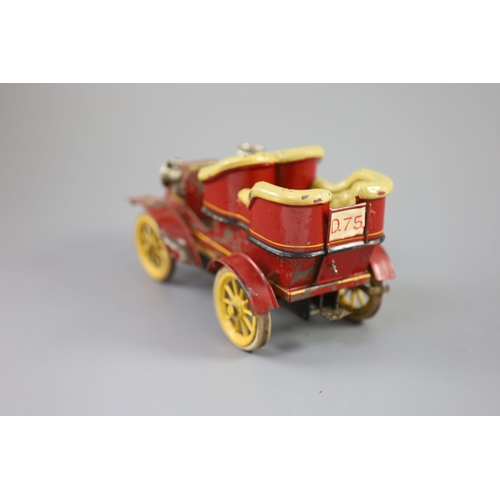 16 - A Bing clockwork tinplate car, c.1906, with cream painted seats, red bodywork and yellow wheels, len... 