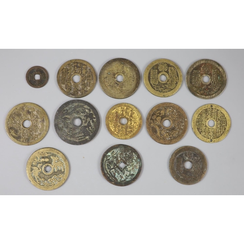 163 - China, 12 cast bronze charms or amulets, Qing dynasty, seven inscribed 'Tai Shang zhou yue..', rev. ... 