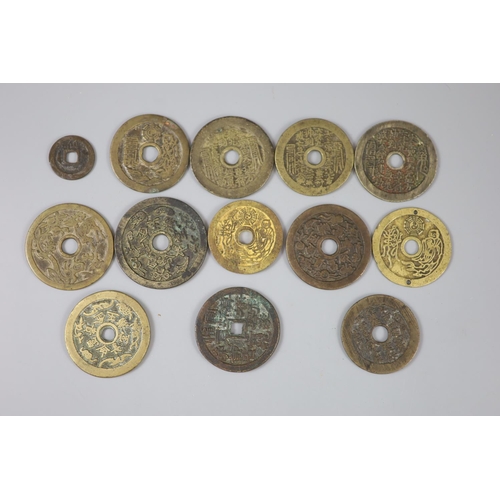 163 - China, 12 cast bronze charms or amulets, Qing dynasty, seven inscribed 'Tai Shang zhou yue..', rev. ... 