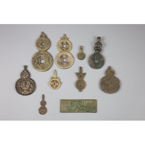 176 - China, 10 bronze charms or amulets, Qing dynasty-Republic period, two Guangxu tong bao double coin f... 