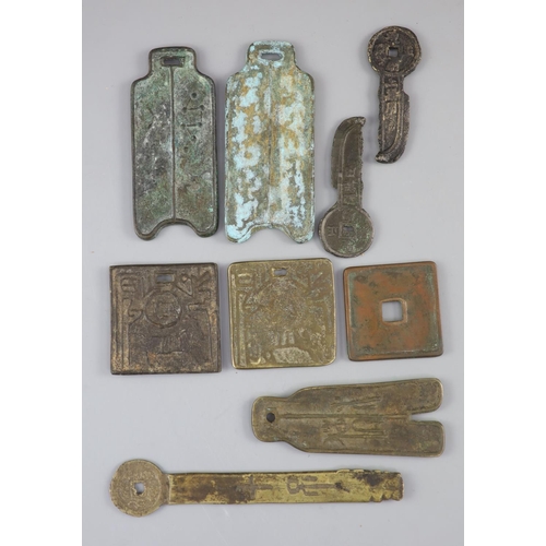 180 - China, 9 large bronze charms or amulets, Qing dynasty-20th century three of spade form, 92-102mm, on... 