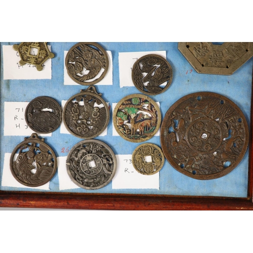 185 - A group of 99 Korean bronze and metal amulets or charms, 19th/20th century largest 70mmCONDITION: tr... 