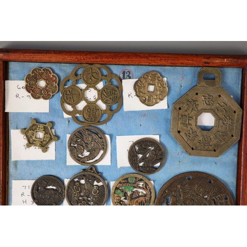 185 - A group of 99 Korean bronze and metal amulets or charms, 19th/20th century largest 70mmCONDITION: tr... 