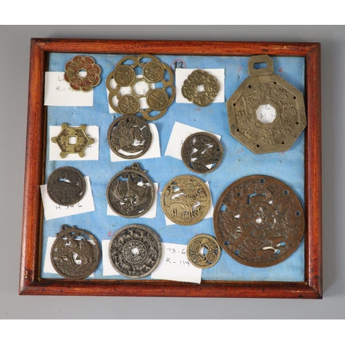 185 - A group of 99 Korean bronze and metal amulets or charms, 19th/20th century largest 70mmCONDITION: tr... 