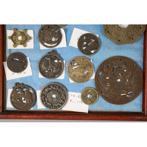 185 - A group of 99 Korean bronze and metal amulets or charms, 19th/20th century largest 70mmCONDITION: tr... 