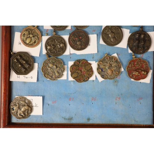 185 - A group of 99 Korean bronze and metal amulets or charms, 19th/20th century largest 70mmCONDITION: tr... 