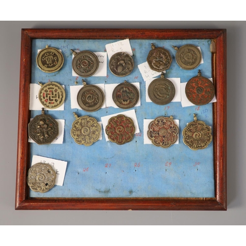 185 - A group of 99 Korean bronze and metal amulets or charms, 19th/20th century largest 70mmCONDITION: tr... 