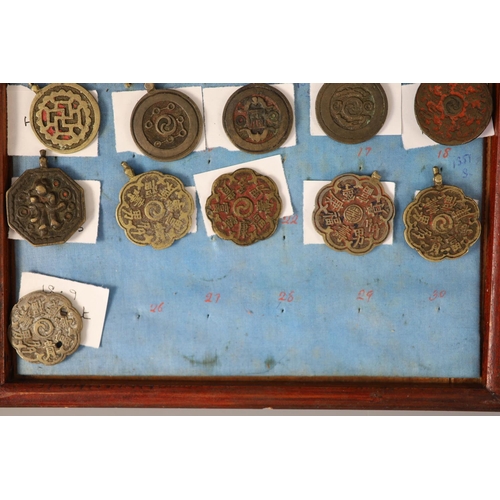 185 - A group of 99 Korean bronze and metal amulets or charms, 19th/20th century largest 70mmCONDITION: tr... 