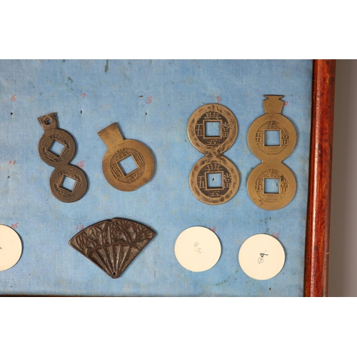 185 - A group of 99 Korean bronze and metal amulets or charms, 19th/20th century largest 70mmCONDITION: tr... 