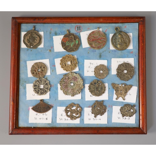 185 - A group of 99 Korean bronze and metal amulets or charms, 19th/20th century largest 70mmCONDITION: tr... 