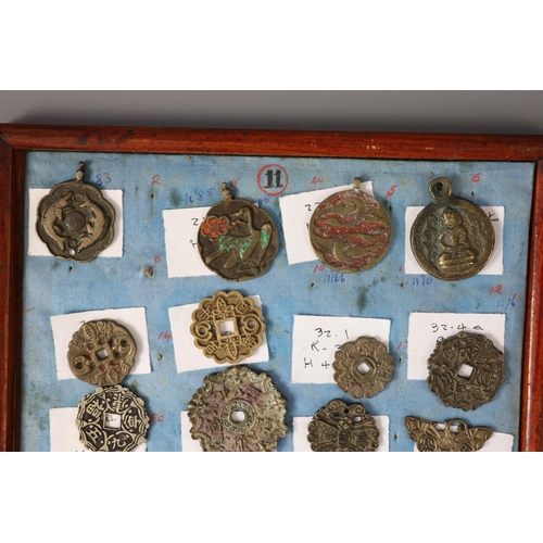 185 - A group of 99 Korean bronze and metal amulets or charms, 19th/20th century largest 70mmCONDITION: tr... 