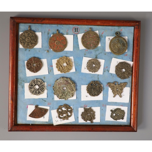 185 - A group of 99 Korean bronze and metal amulets or charms, 19th/20th century largest 70mmCONDITION: tr... 