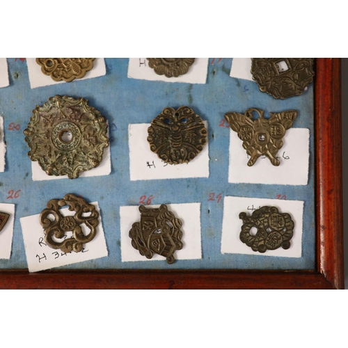 185 - A group of 99 Korean bronze and metal amulets or charms, 19th/20th century largest 70mmCONDITION: tr... 