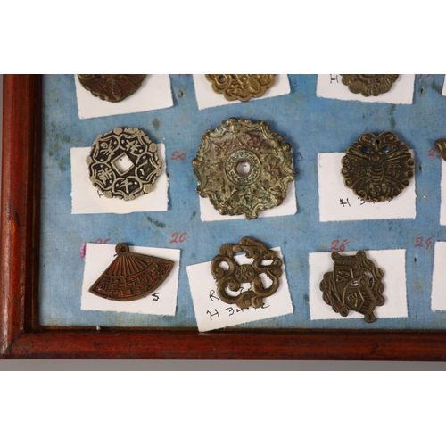 185 - A group of 99 Korean bronze and metal amulets or charms, 19th/20th century largest 70mmCONDITION: tr... 