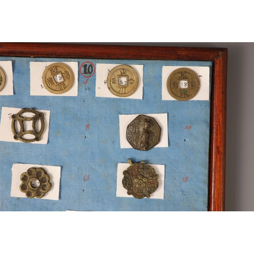 185 - A group of 99 Korean bronze and metal amulets or charms, 19th/20th century largest 70mmCONDITION: tr... 