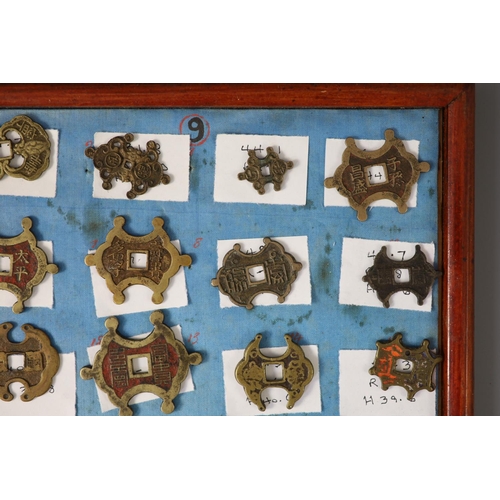 185 - A group of 99 Korean bronze and metal amulets or charms, 19th/20th century largest 70mmCONDITION: tr... 